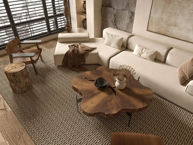 Svijetli dnevni boravak s neutralnim tepihom, toplim prirodnim detaljima i modernim stilom interijera
